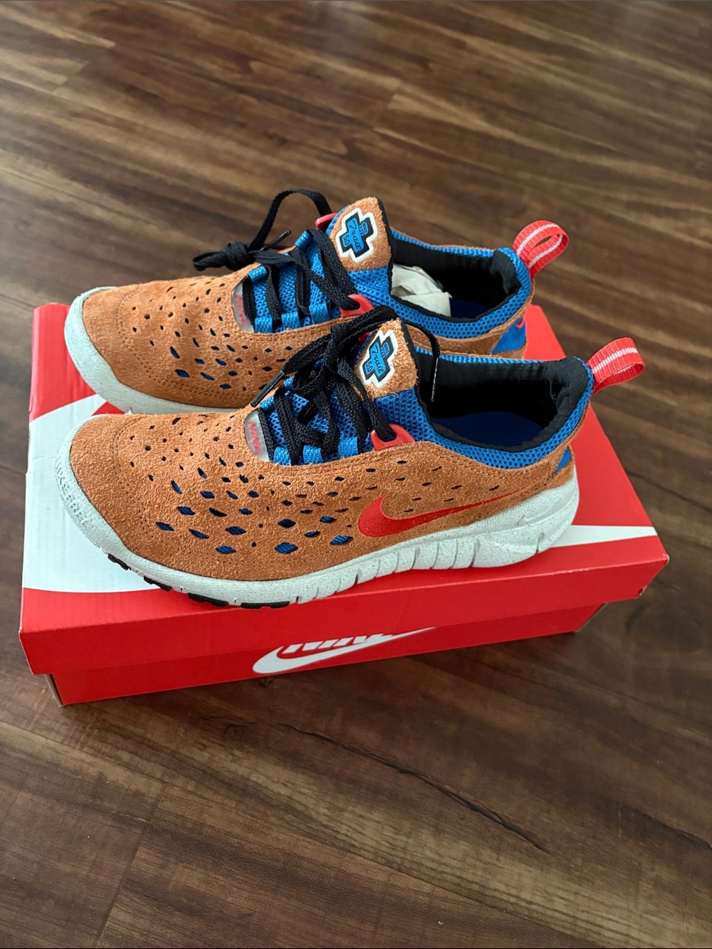 Nike Free Run Trail Suede Sneakers with Blue and Red Accents